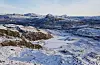 Vinterbilde frå Suldal. Frøkjedalsvatnet midt i bilde med Gullingen og Napen i bakgrunn. Foto er tatt 10. desember 2024.